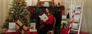 Woman holding Bible study in a christmas filled set